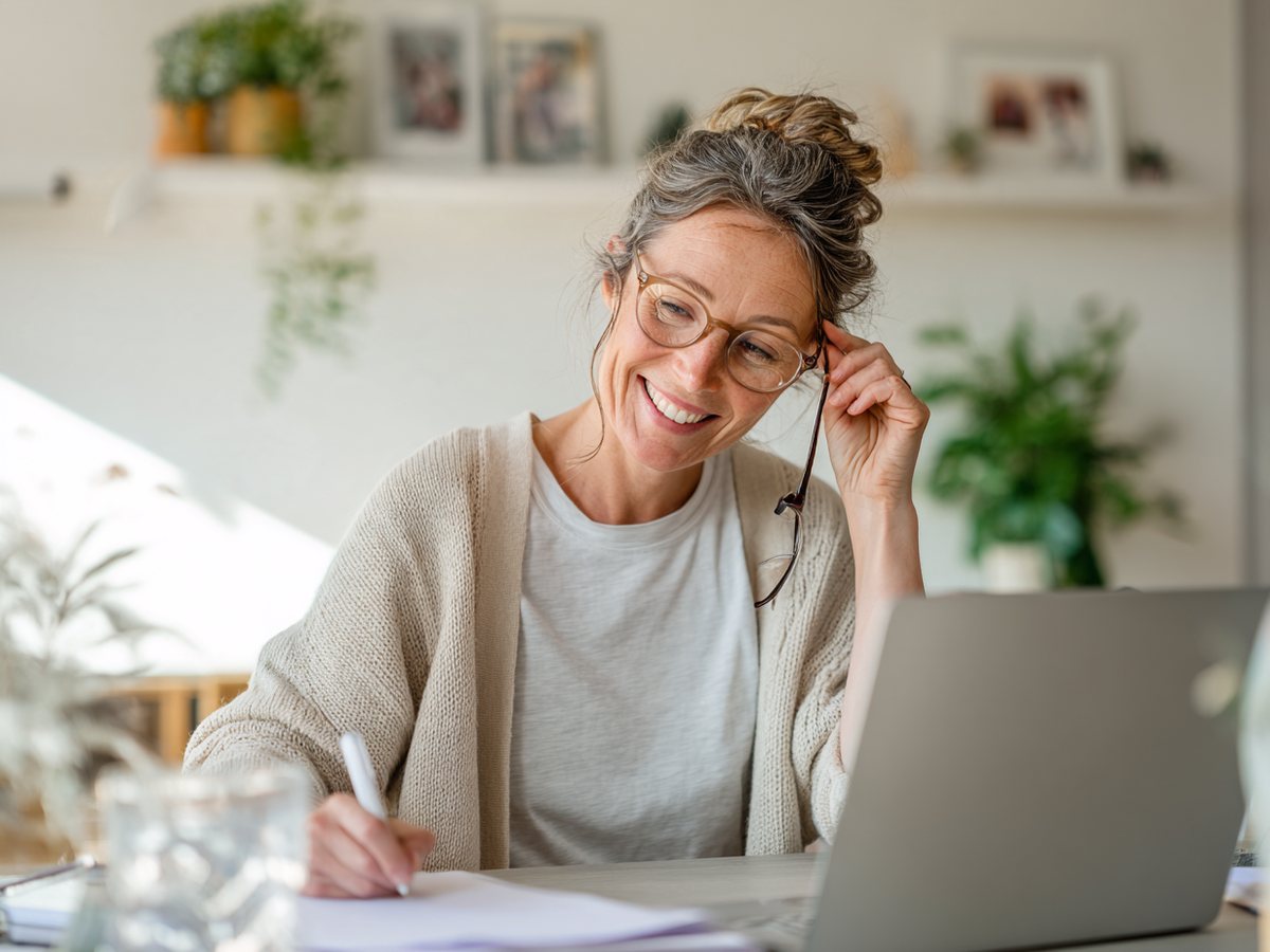 A coach at her desk, on a call