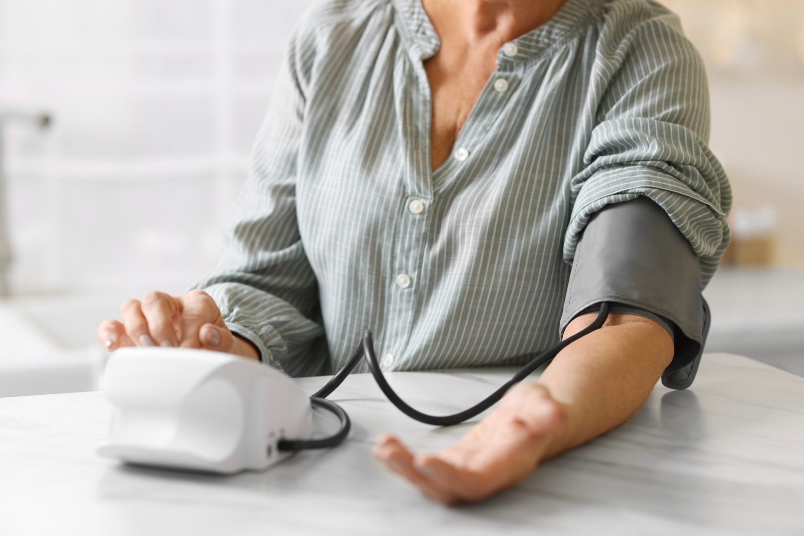 A blood pressure reading at the kitchen counter