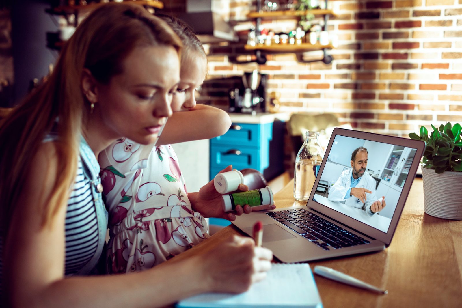 A mother with her daughter on a video call, going through the medications together